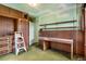 Bedroom with built-in shelving, desk, and cabinetry, offering functional storage and workspace at 4730 Pierce St, Wheat Ridge, CO 80033