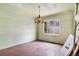 Dining room with chandelier and a large window, perfect for entertaining at 4730 Pierce St, Wheat Ridge, CO 80033
