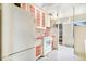 Kitchen area featuring vintage white appliances, and a stainless steel sink at 4730 Pierce St, Wheat Ridge, CO 80033