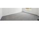 A large bedroom featuring neutral carpet and bright white walls at 45934 Gentry Ave, Bennett, CO 80102