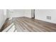 Bright living room with vinyl floors and natural light, offering versatile space for any decor at 45934 Gentry Ave, Bennett, CO 80102