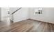 Inviting living room with stylish vinyl floors and neutral wall paint for a cozy atmosphere at 45934 Gentry Ave, Bennett, CO 80102