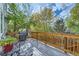 A backyard deck with a grill and seating, perfect for outdoor dining and enjoying the surrounding nature at 13723 Milwaukee Ct, Thornton, CO 80602