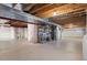 Spacious unfinished basement with exposed beams and ductwork, offering plenty of potential for customization at 13723 Milwaukee Ct, Thornton, CO 80602