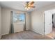 Bedroom featuring carpet, a ceiling fan, and a window providing natural light at 13723 Milwaukee Ct, Thornton, CO 80602