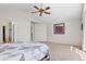 Spacious bedroom featuring a ceiling fan, neutral walls, and cozy carpeting at 13723 Milwaukee Ct, Thornton, CO 80602