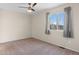 Cozy bedroom with neutral walls, carpet, and a large window at 13723 Milwaukee Ct, Thornton, CO 80602