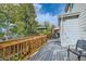 A spacious wooden deck area is perfect for outdoor seating and relaxation, with views of lush greenery at 13723 Milwaukee Ct, Thornton, CO 80602