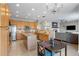 The eat-in kitchen features a center island, granite countertops, and stainless steel appliances at 13723 Milwaukee Ct, Thornton, CO 80602