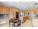 Spacious kitchen features abundant storage, granite counters, and stainless steel appliances at 13723 Milwaukee Ct, Thornton, CO 80602