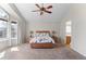 Spacious main bedroom with vaulted ceiling, a ceiling fan, and an abundance of natural light at 13723 Milwaukee Ct, Thornton, CO 80602