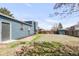 Spacious backyard with blue siding on the home and storage shed surrounded by wood fence at 10024 Holland Ct, Broomfield, CO 80021