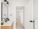 Bathroom featuring a modern mirror and open doorway at 10024 Holland Ct, Broomfield, CO 80021