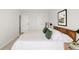 Bedroom features a modern bed frame with green throw pillows at 10024 Holland Ct, Broomfield, CO 80021