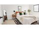 Well-lit bedroom featuring a black and white rug and a modern wooden bed frame at 10024 Holland Ct, Broomfield, CO 80021