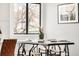 Dining room with an abundant of natural light, hardwood floors, and contemporary furnishings at 10024 Holland Ct, Broomfield, CO 80021