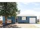 Inviting single-story home features a well-manicured lawn, new exterior paint, and attached one-car garage at 10024 Holland Ct, Broomfield, CO 80021