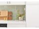 Bright kitchen boasts green subway tile backsplash, white countertops, and cabinets at 10024 Holland Ct, Broomfield, CO 80021