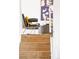 Staircase with leather chair and modern wall art at 10024 Holland Ct, Broomfield, CO 80021