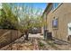 Backyard with patio area, landscaping and a shade tree at 1204 S Balsam Ct, Lakewood, CO 80232
