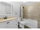 Neutral bathroom with a modern vanity and a shower-tub combination with tile surround at 1204 S Balsam Ct, Lakewood, CO 80232