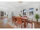 Bright dining room with hardwood floors and natural light from windows at 1204 S Balsam Ct, Lakewood, CO 80232