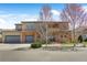 Charming two-story home featuring a three-car garage, stone accents, and lovely curb appeal at 1204 S Balsam Ct, Lakewood, CO 80232