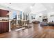 Bright, open-concept living space with hardwood floors, modern furnishings, and a cozy fireplace at 1204 S Balsam Ct, Lakewood, CO 80232