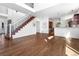 Bright living space with a staircase, and dining area showcasing an open-concept design at 1204 S Balsam Ct, Lakewood, CO 80232