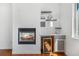 Cozy living space features a fireplace, custom shelving, and a beverage center with a wine fridge at 1204 S Balsam Ct, Lakewood, CO 80232