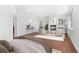 Spacious main bedroom features wood floors, a fireplace, and sitting area, offering a comfortable retreat at 1204 S Balsam Ct, Lakewood, CO 80232