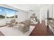 Bright main bedroom with wood floors, sitting area, and windows offering plenty of natural light at 1204 S Balsam Ct, Lakewood, CO 80232