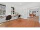 Bright office space with hardwood floors and a built-in desk at 1204 S Balsam Ct, Lakewood, CO 80232