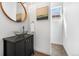 Stylish powder room featuring a vessel sink and modern fixtures at 1204 S Balsam Ct, Lakewood, CO 80232