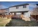 Back of house featuring a deck, yard, and ample natural light, providing a serene outdoor setting at 1188 Mulberry Ln, Highlands Ranch, CO 80129