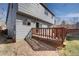 Backyard featuring the house with a deck, partial gravel area, and lawn, ideal for relaxing and entertaining at 1188 Mulberry Ln, Highlands Ranch, CO 80129