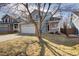 Charming two-story home with a well-manicured front yard and a two-car garage at 1188 Mulberry Ln, Highlands Ranch, CO 80129