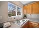 A kitchen sink with a view of the outdoors from a bright sunny window at 1188 Mulberry Ln, Highlands Ranch, CO 80129