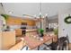Well-lit eat in kitchen and adjacent living area offer a perfect blend of style and functionality at 1188 Mulberry Ln, Highlands Ranch, CO 80129