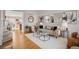 Open-concept living room featuring hardwood floors and comfortable seating arrangements at 1188 Mulberry Ln, Highlands Ranch, CO 80129