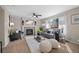 Spacious living room features a fireplace, neutral décor, and large windows for natural light at 1188 Mulberry Ln, Highlands Ranch, CO 80129