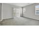 Spacious bedroom with plush carpeting and sliding glass doors to the balcony at 200 Whitehaven Cir, Highlands Ranch, CO 80129