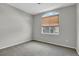 Comfortable bedroom features plush carpet and a large window for ample natural light at 200 Whitehaven Cir, Highlands Ranch, CO 80129