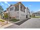 Charming two-story townhome featuring a private balcony, two-car garage, and landscaped front yard at 200 Whitehaven Cir, Highlands Ranch, CO 80129
