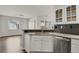 Modern kitchen with granite countertops, stainless steel appliances, and white cabinetry at 200 Whitehaven Cir, Highlands Ranch, CO 80129