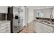 Modern kitchen with stainless steel appliances, granite countertops, and mosaic tile backsplash at 200 Whitehaven Cir, Highlands Ranch, CO 80129