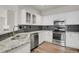 Beautiful kitchen with stainless appliances, granite countertops, and ample cabinet space at 200 Whitehaven Cir, Highlands Ranch, CO 80129