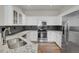Well-appointed kitchen featuring stainless appliances, sleek backsplash, and granite countertops at 200 Whitehaven Cir, Highlands Ranch, CO 80129