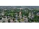 Aerial view of the property in a residential area, featuring mature trees at 12671 Home Farm Ln, Westminster, CO 80234