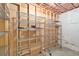 Unfinished basement area with ample storage and metal shelving installed at 12671 Home Farm Ln, Westminster, CO 80234